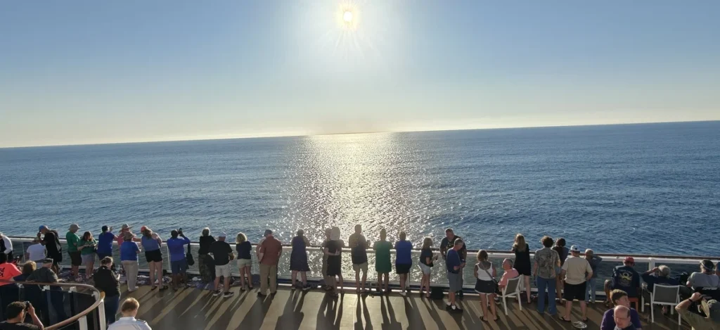 Guests onboard Carnival Legend enjoy the cruise line's first-ever Solar Eclipse sailing
