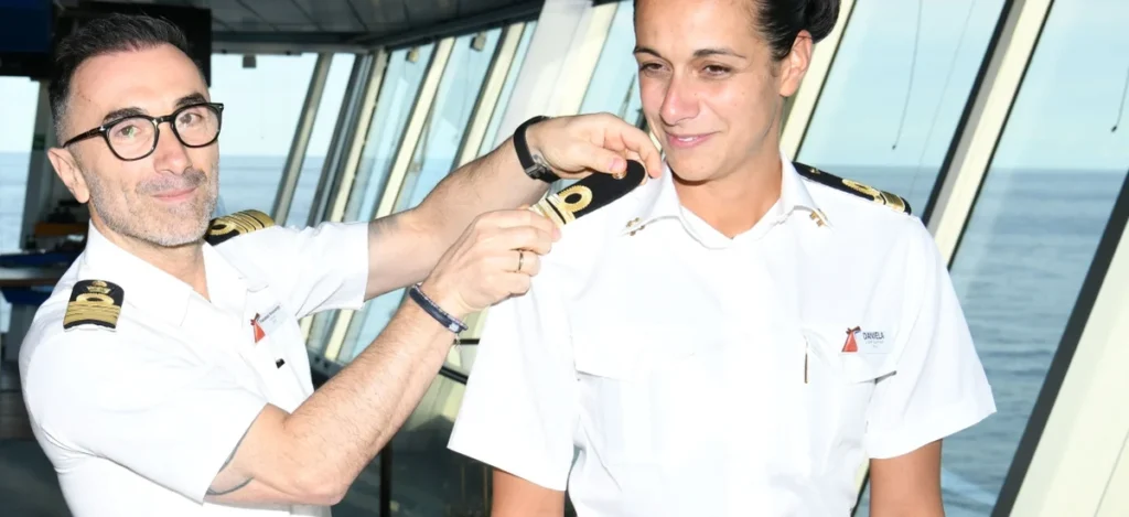 Captain Francesco Bencivenga places the epaulettes on Daniela Gargiulo